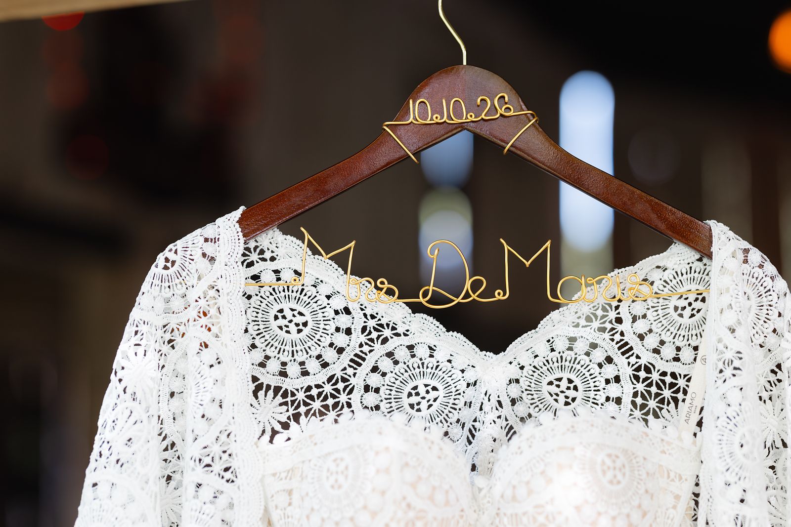 Lace wedding dress detail on a custom Mrs. DeMaris hanger