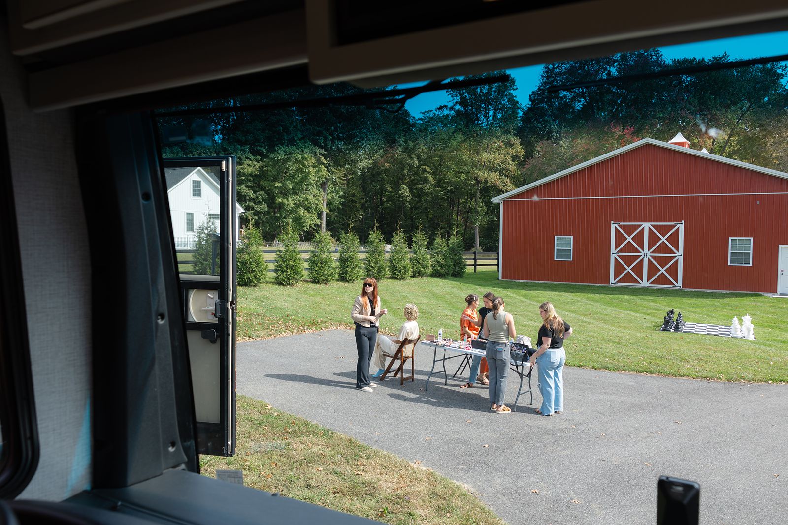 View of the red barn at Warburton Stables from the motorcoach window on the wedding morning