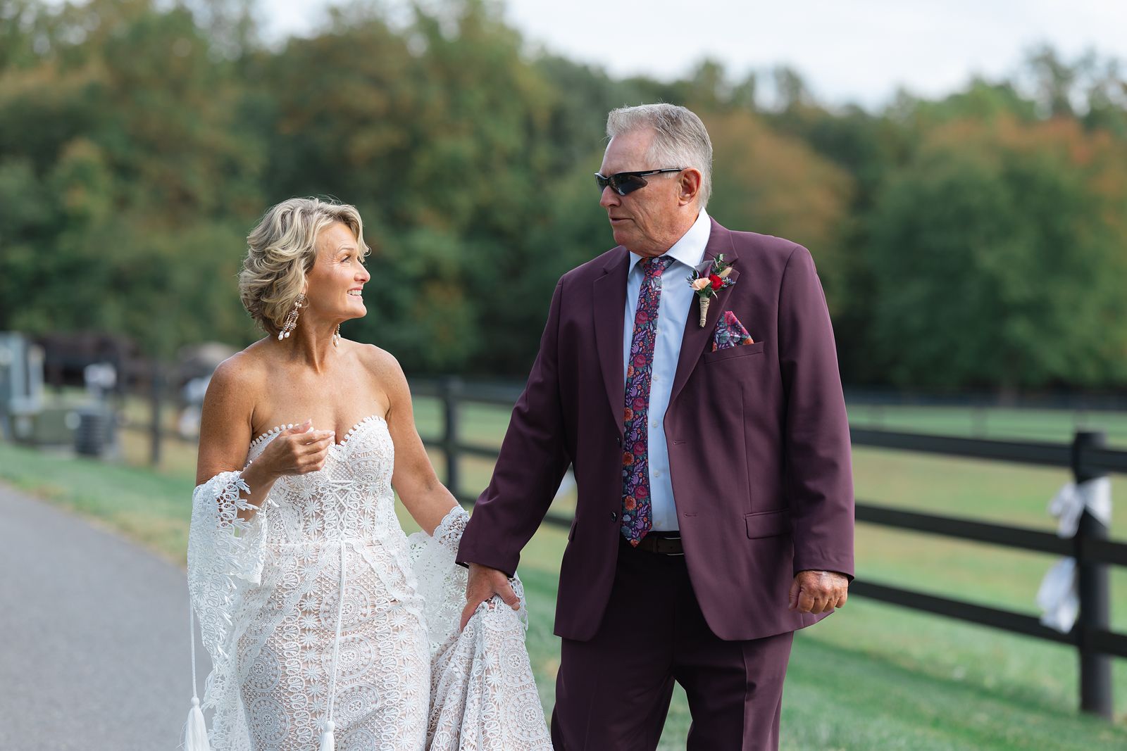 Shannon and Brian walking together along the farm road