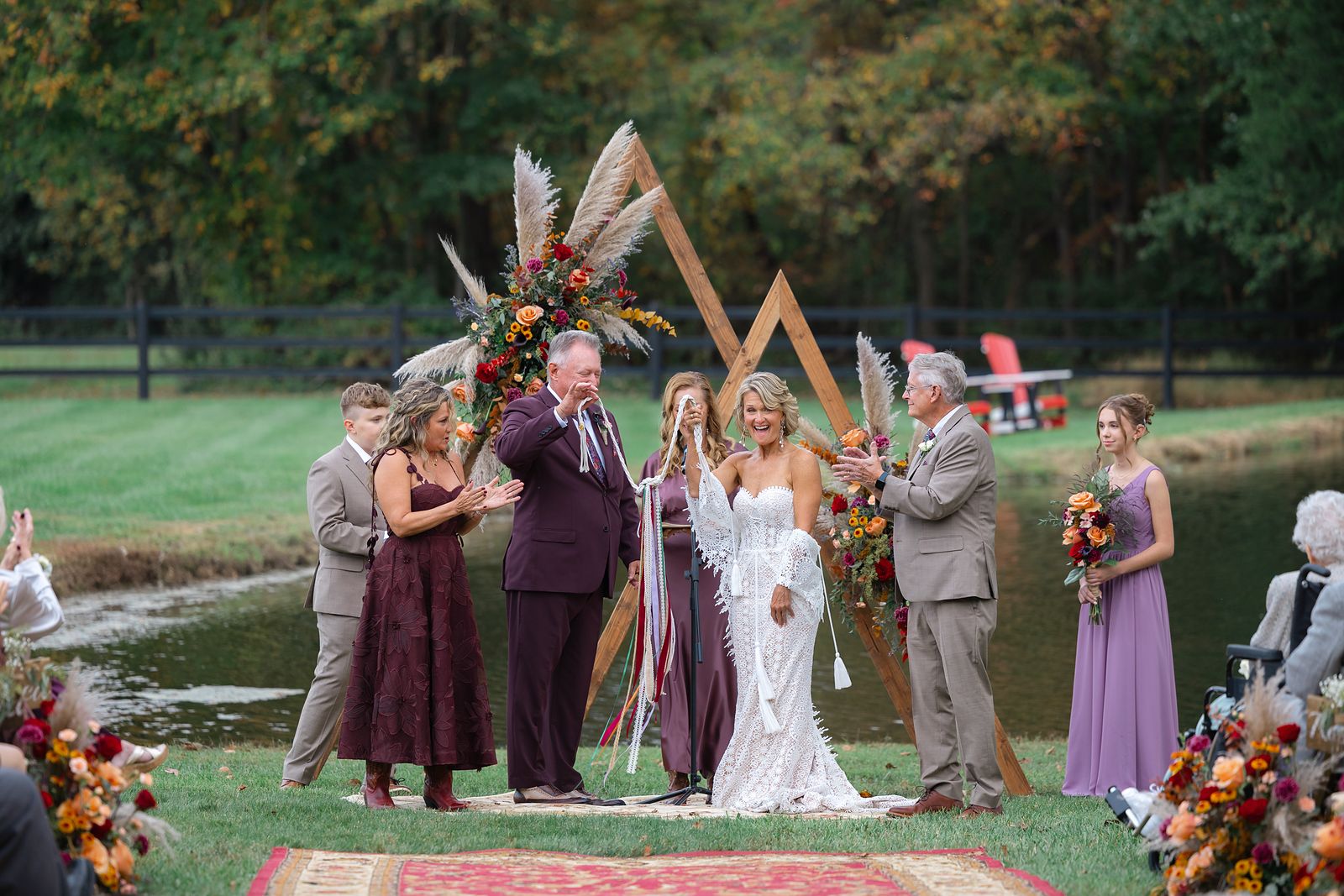 Shannon and Brian with their children at the arch during the handfasting
