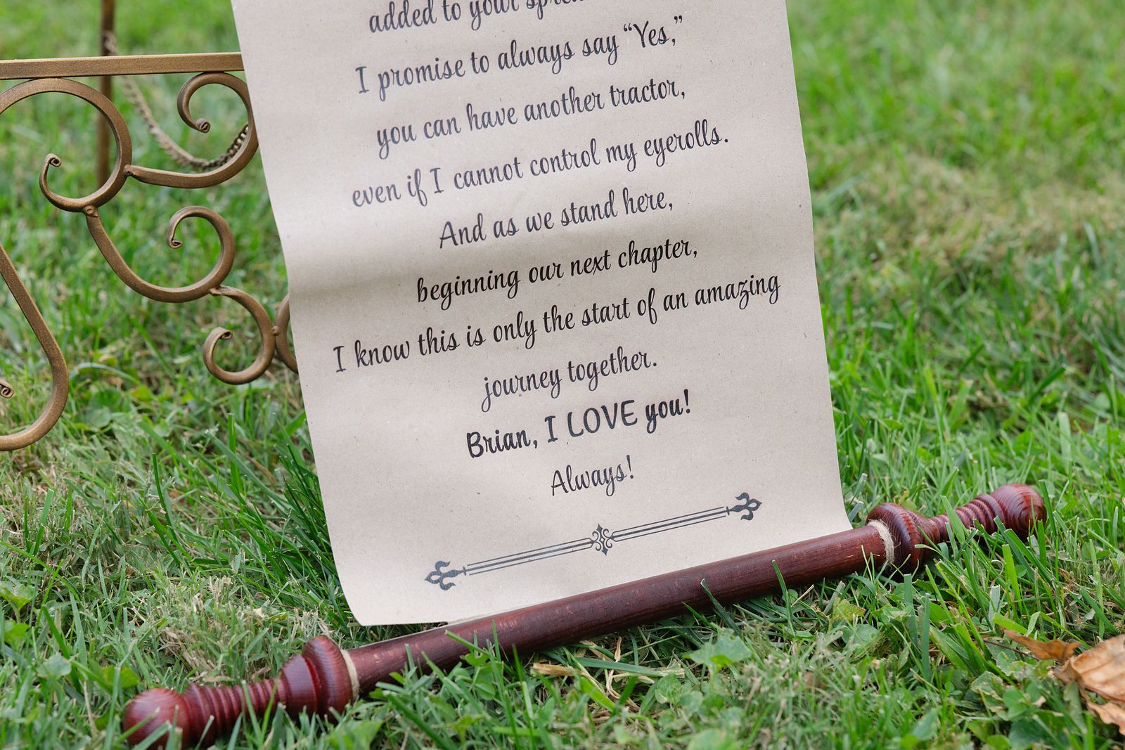 Shannon's handwritten vow scroll resting in the grass