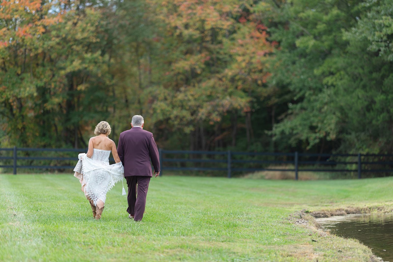 Shannon and Brian walking off alone after the ceremony toward the woods