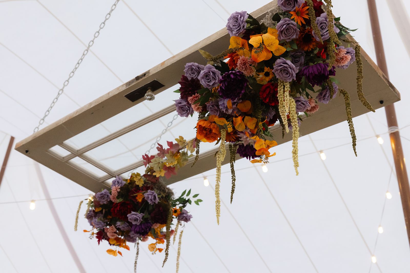Hanging floral installation in the sailcloth tent