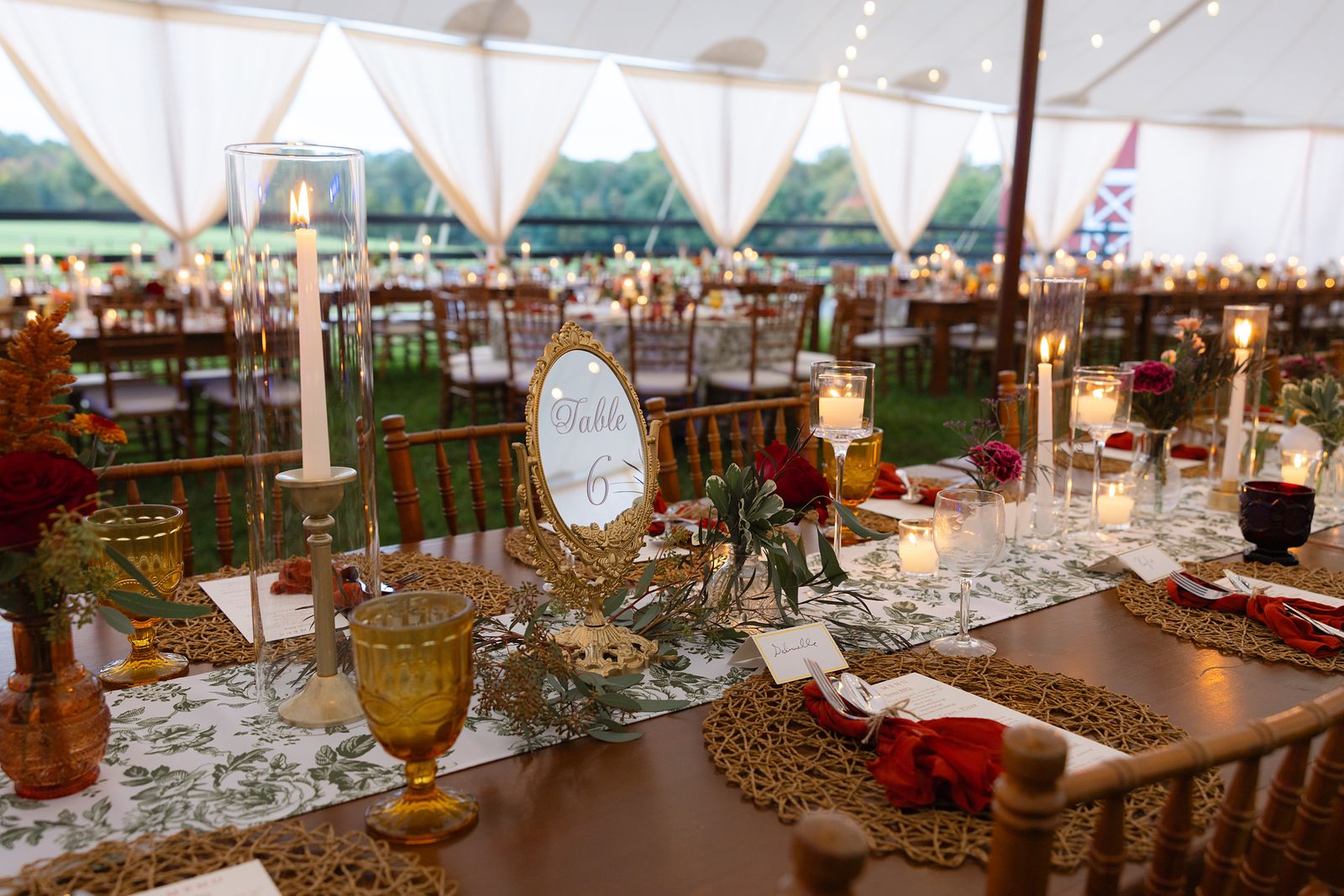 Wide view of the reception tent at Warburton Stables with the farm beyond