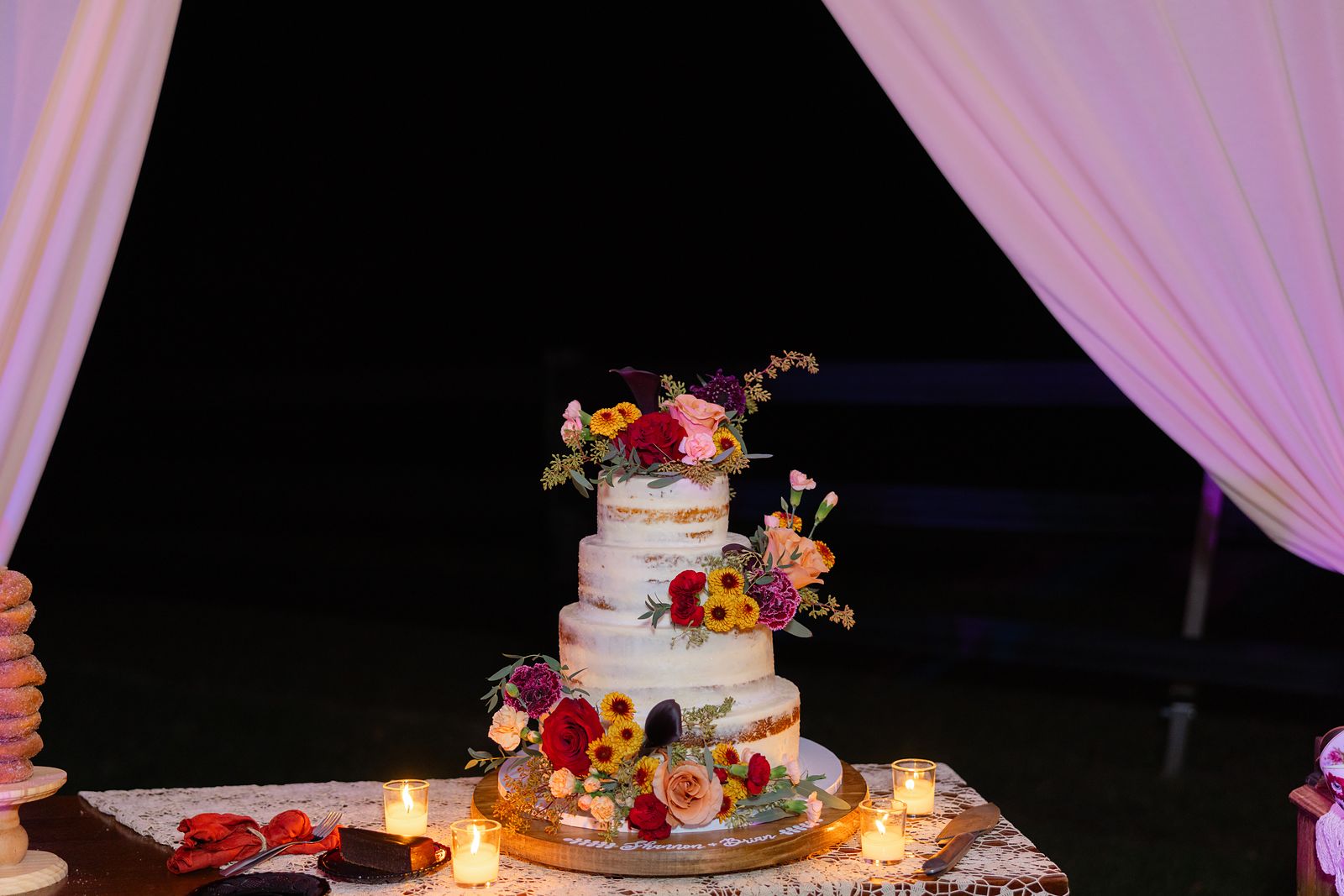 The wedding cake under the tent at night